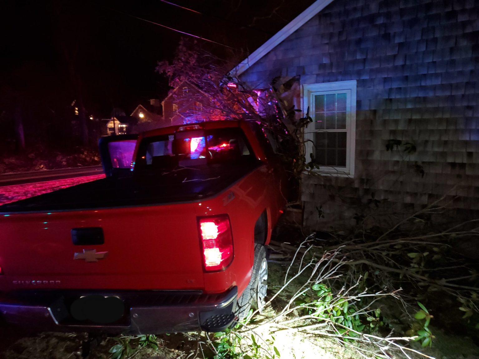 Updated: Driver charged with OUI after pickup slams into house in Falmouth