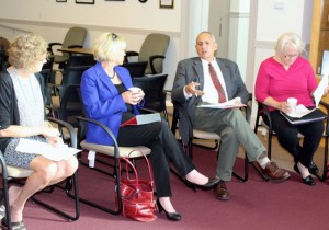 CCB MEDIA PHOTO Barnstable Assistant Town Manager Mark Ells talks at a meeting of the Day Center Steering Committee, as Paula Schnepp, coordinator of the Regional Network on Homelessness; County Commission Chair Sheila Lyons; and Barnstable Town Councilor Ann Canedy listen.