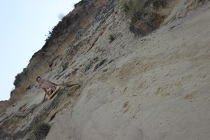 CHRISTA ZEVITAS PHOTO. A child "surfs" the dunes in Wellfleet--a controversial activity. Signs forbid people from the dunes to prevent more erosion.