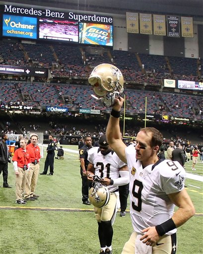 New Orleans Saints quarterback Drew Brees (9) runs off the field after the second half of an NFL football game against the Atlanta Falcons, Thursday, Oct. 15, 2015, in New Orleans. The New Orleans Saints won 31-21. (AP Photo/John Bazemore)