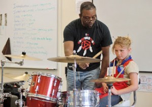  Eddie Ray leading a workshop for young, aspiring drummers.