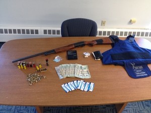 PHOTOS COURTESY FALMOUTH POLICE DEPARTMENT. Among the items seized from the home in Falmouth were a shotgun, drugs and a ballistic vest.