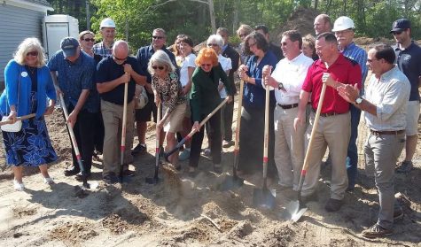 Members of the Sandwich Chamber of Commerce, Sandwich Town Staff and supporters of the new Visitor's Center break ground on the site of the new facility.