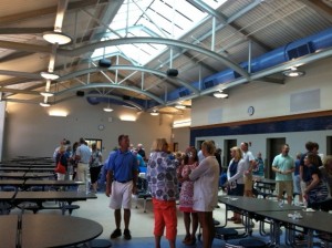 Visitors admire the new cafeteria after the ribbon-cutting at Monomoy High School.
