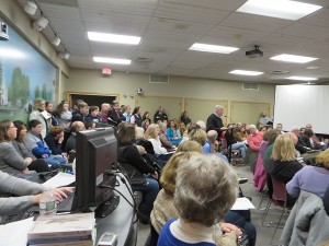 CCB MEDIA PHOTO Crowds of students, teachers and parents squeeze into the selectmen's meeting room at Harwich Town Hall last night.