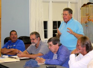 CCB MEDIA PHOTO Falmouth restaurant owner Paul Rifkin speaks at a meeting he organized last night to discuss homelessness prevention initiatives in Falmouth. Sitting are leaders of the Hyannis-based agency Homeless Not Hopeless, including Darrell Grey, Alan Burt, Billy Bishop and Bobby McGillveary.