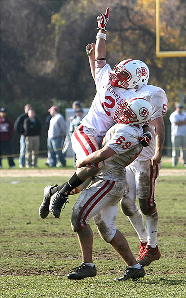 In 2008, then captains Isaiah Voegeli and Rob Bancroft celebrate their Red Raider Turkey Day victory at Fuller Field. Voegeli went on to a brilliant All-American career at Merrimack and Bancroft graduated from the Massachusetts Maritime Academy with honors. Sean Walsh photo