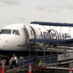 Passengers disembark from the last Jet Blue flight of the season at Barnstable Municipal Airport on Tuesday.