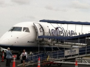 Passengers disembark from the last Jet Blue flight of the season at Barnstable Municipal Airport on Tuesday.