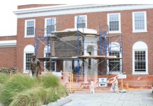 COURTESY BARNSTABLE TOWN HALL. Scaffolding covers the portico of the JFK Museum in Hyannis while restoration work is underway.