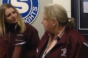 Falmouth High School athletic director Kathleen Burke talks to Clipper girls' ice hockey coach Erin Hunt after a recent game. Sean Walsh/Capecod.com Sports