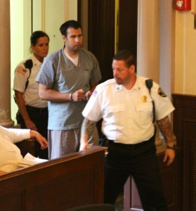 CCB MEDIA PHOTO Adrian Loya, a suspect in a murder in Bourne last February, is brought into Barnstable Superior Court yesterday for his arraignment.