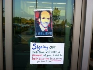 Signs on entrance door of the Market Basket in Sagamore show ousted CEO Arthur T. Demoulas.