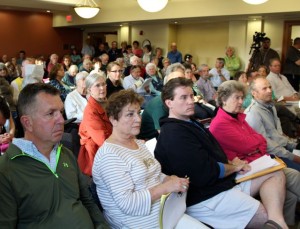 CCB MEDIA PHOTO Dan Webb, left, and Harriet and Robert Dugan were among those who turned out to oppose the Marriott Hotel proposed for the east end of Main Street in Falmouth.