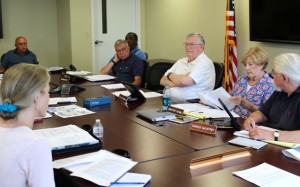 CCB MEDIA PHOTO The Cape Cod Commission subcommittee reviewing the Springhill by Marriott project discusses the project's benefits and detriments. Ernie Virgilio of Mashpee, at head of table, chairs the subcommittee. John D. Harris, Richard Roy, Jack McCormack and Mary Pat Flynn are voting members of the subcommittee. Charles McCaffrey, at far right, is a non-voting member.