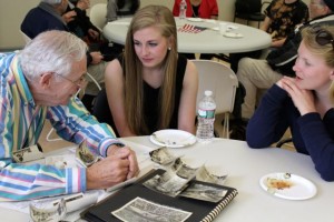 CCB MEDIA PHOTO Jackie Roycroft and Annie Spence talk with Irwin Feigelman, who served in the Army in the Korean War.