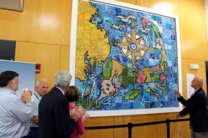 CCB MEDIA PHOTO Jim Hurley, Managing Director of Cape Cod CAN!, unveils the new mural at the Hyannis Transportation Center.