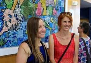 CCB MEDIA PHOTO Cape Cod CAN Art Director Tessa D'Agostino poses in front of the mural with Jennifer Stratton, who worked as a teacher on the project.