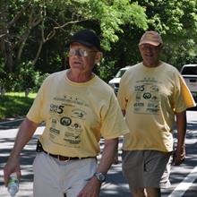 COURTESY OF THE BOB MURRAY HOUSING WITH LOVE WALK. Bob Murray walks in front of Rick Presbrey of Housing Assistance Corporation during the Housing With Love Walk in 2010.