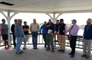 CCB MEDIA PHOTO Richard Bourre, in cap, of the Massachusetts Environmental Policy Office, hears from residents and officials about off-road driving use on the Nauset Spit.