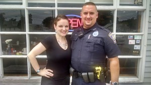 BOB SURRETTE PHOTO Dennis Police Officer Ryan Carr, who organizes the National Night Out event, poses with his wife, Chrissy, outside her restaurant, Good Friends Café, on School Street in West Dennis.