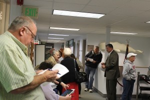 Selectman Kevin Murphy is among those waiting for election results at Falmouth Town Hall Tuesday night.