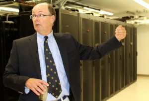 CCB MEDIA PHOTO Dan Gallagher, former co-founder of Open Cape, shows off the service racks that Open Cape rents out to municipalities and other entities on the Cape. Speed and reliability are two main benefits provided by the Open Cape broadband network, he said.