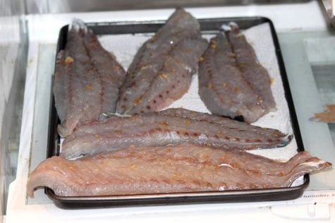 After your fillets have soaked in brine, it’s important to dry them for a few hours in the refrigerator before putting them on the smoker. Sprinkling a little brown sugar on them will help form a nice glaze on the finished product.