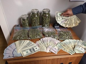 COURTESY OF STATE POLICE. Drugs and money seized as part of a raid on Nantucket, according to state police.