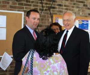 CCB MEDIA PHOTO Rick Presbrey, at right, stands with his attorney Matthew Kelly, talking to well-wishers after the misdemeanor charge against him was dismissed.