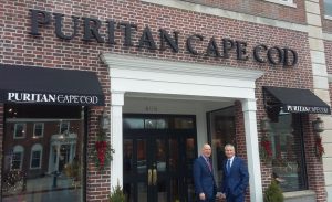 Rick Penn and Jim Penn stand in front of their store, Puritan Cape Cod, on Main Street in Hyannis.
