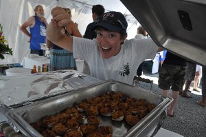 COURTESY HAC Heather Meehan from Housing Assistance Corporation goes after a stuffed clam from the Arnold's Lobster and Clam Bar.