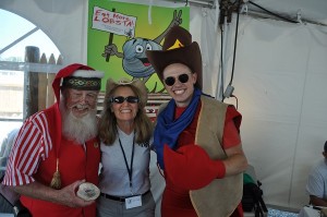 COURTESY HACE Santa Claus, Deanne Bussiere from Housing Assistance Corporation, and Blaze, the lobster, gather for a "shell-fie," a photo with Doug the Clam.