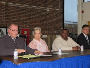 Mashpee Police Chief Rodney Collins talks about community policing as Elenita Muniz, coordinator of the Barnstable County Human Rights Commission; John Reed, chair of the Human Rights Commission, and District Attorney Michael O'Keefe look on.