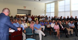 CCB MEDIA PHOTO Rodney Collins speaks to a full gathering at Mashpee Town Hall.