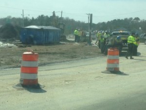 SEAN WALSH/CCB MEDIA PHOTO Police and cleanup crews on the scene at the Bourne Rotary as cleanup continues on the gas spill.