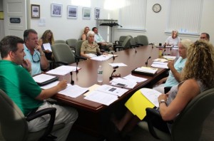 CCB MEDIA PHOTO Members of the Barnstable Town Manager Search Committee discuss hiring an outside search firm this week. Committee members include Eric Steinhilber, Sara Cushing, Ann Canedy, James Crocker and Paul Hebert, along with John Crow, who is president of the Osterville Village Association, and Phyllis Miller, vice president of the Cotuit-Santuit Civic Association. Sitting at the far end of the table is Town Council Administrator Cynthia Lovell. In the audience at Tuesday's meeting were Town Council President Jessica Rapp-Grassetti, and town councilors Jennifer Cullum and Fred Chirigotis.