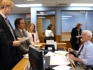 CCB MEDIA PHOTO Attorney Drew Segadelli, center, appears in Falmouth District Court at a pretrial hearing for his client murder suspect Adrian Loya.