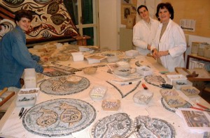 COURTESY CHURCH OF THE TRANSFIGURATION Sister Agnes Whichard, left, with Alessandra Caprara in her studio in Ravenna, Italy working on a section of the floor mosaic for the Church of the Transfiguration.