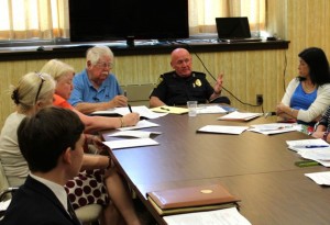 CCB MEDIA PHOTO Barnstable Police Chief Paul MacDonald talks to a group of community leaders gathered in a conference room at the Barnstable Police Department last night. Hyannis Civic Association members Ralph and Deborah Krau are at left and Town Attorney Ruth Weil is at right.