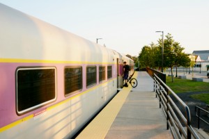 CCB MEDIA PHOTO A bicyclist quickly boards the Cape Flyer Monday night moments before it departs for its final run this year.