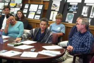 Ramona Peters, founder of the Native Land Conservancy, explains the purpose of the new trust, as others including, Mark Robinson, right, executive director of The Compact of Cape Cod Conservation Trusts, listen.