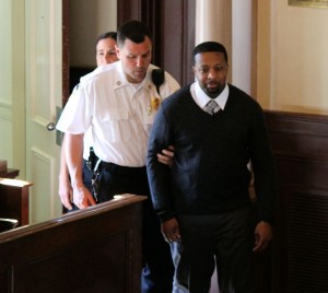 CCB MEDIA PHOTO Quoizel Wilson is led into court. He is on trial for first degree murder in the death of Trudie Hall in 2010.